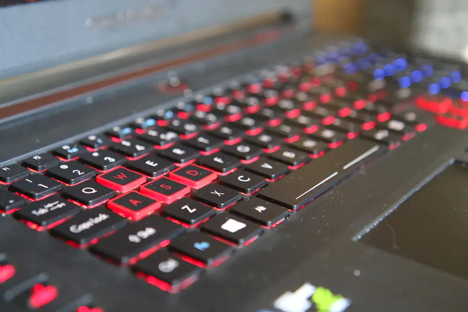 Red backlit gaming keyboard on a laptop
