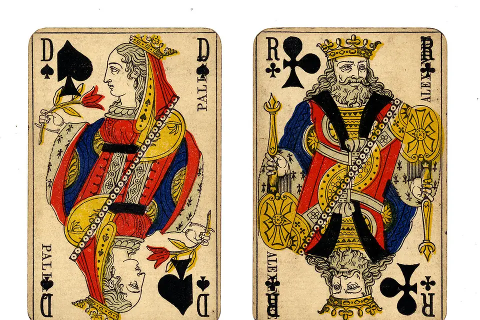 Antique queen of spades and king of clubs playing cards